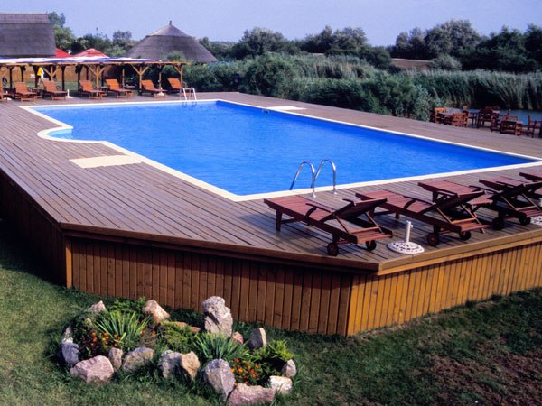 pool-soilless-half-buried-deckchairs