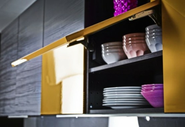 black cabinets and shiny yellow drawer