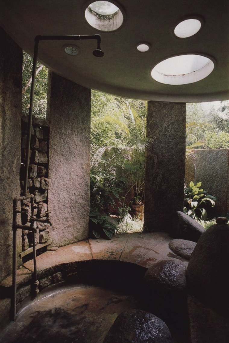 stone bathroom with perforated ceiling