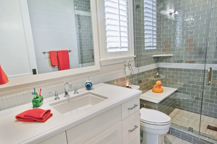 bathroom tile gray towel red toilet