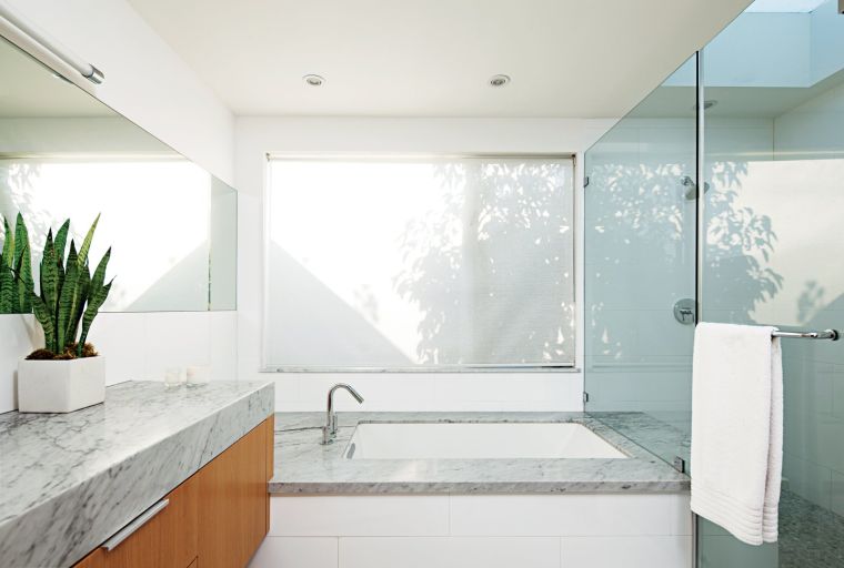 gray bathroom and white marble-worktop