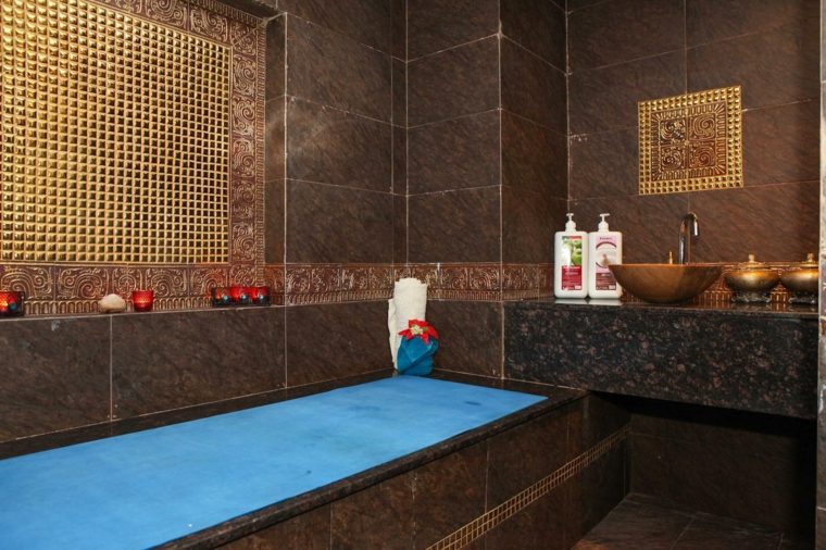 Moroccan bathroom tile brown blue bathtub