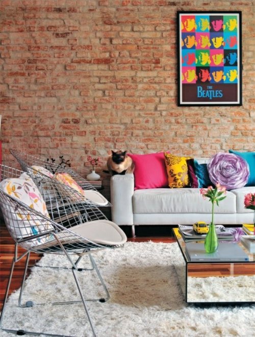 Stylish and elegant lounge with a red brick wall