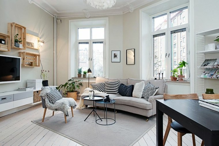 Skandinavisk inspirasjon design gulvteppe grå sofa pute deco vegg ide lenestol svart trebord