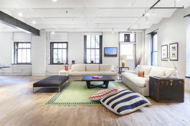 spacious living room exposed beams wood