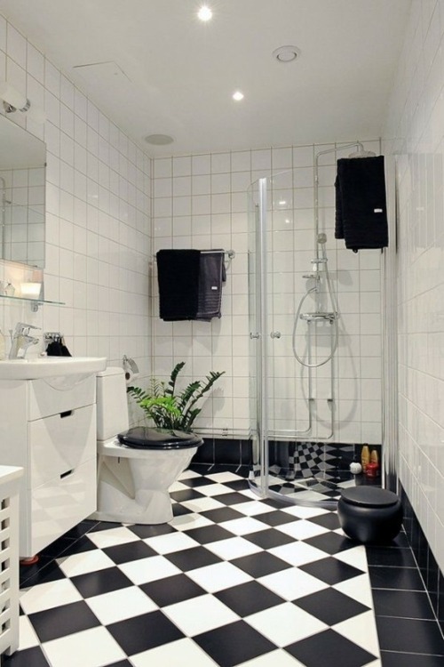 black tiled floor white bathroom