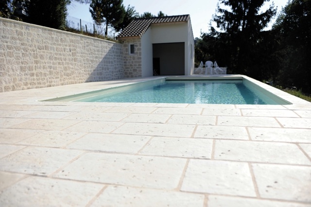 ground terrace stone swimming pool