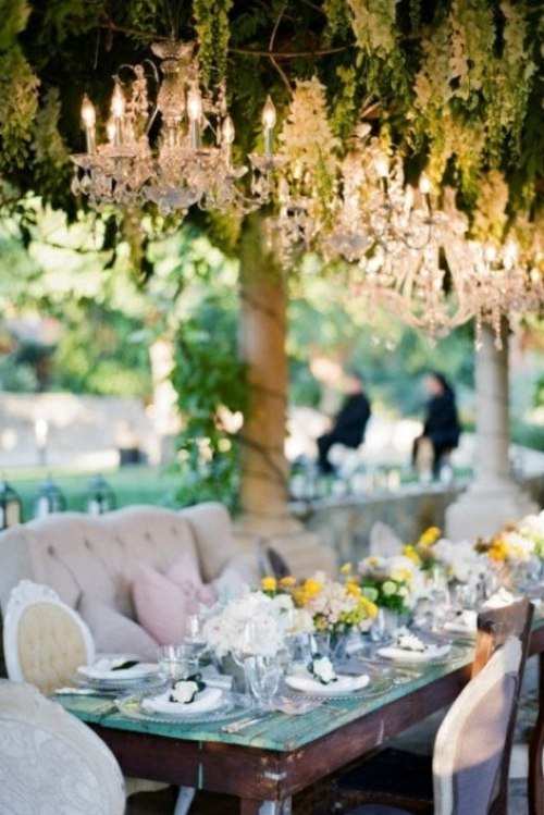 stunning glamorous style chandeliers overlook table