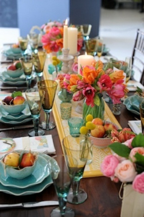 convivial table adorned brightly colored turquoise plates