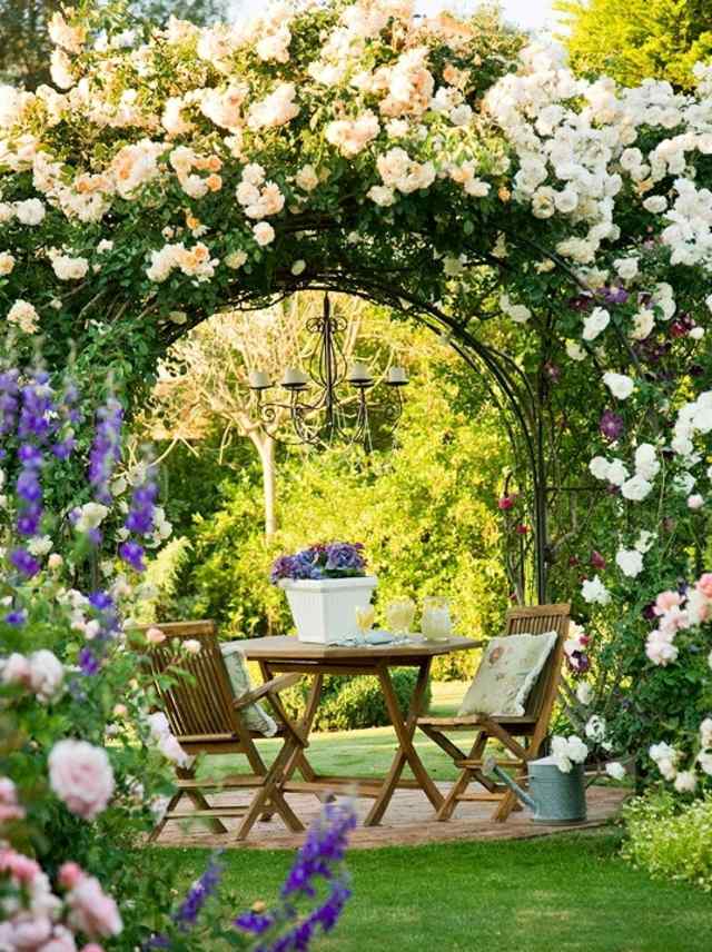 garden landscaping idea garden table wood chair deco flowers