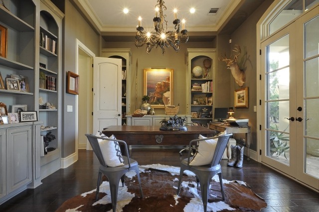 carpet-skin-cow-brown-white-elegant-dining-room-table-wood-chandelier-iron carpet cowhide
