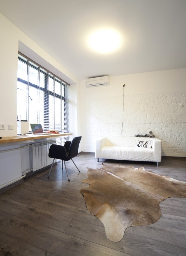 carpet-skin-cow-brown-light-office-home-sofa-white-chair-black carpet cowhide