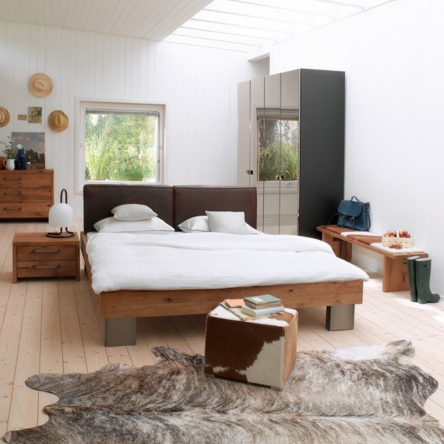 carpet-skin-cow-brown-patterns-black-bedroom-bed-furniture-elegant-wood rug cowhide