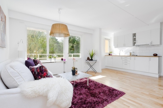 carpet-purple-living-room-open-kitchen-sofa-upholstered-white-small-table-low rug purple