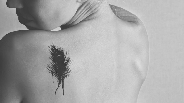 tattoo feather tattoo back woman ideas