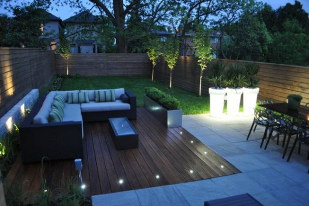 furnished terrace with spotlights and lit pots