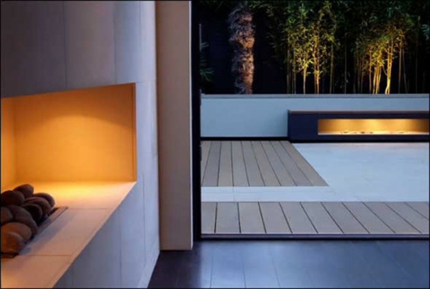 wood covered terrace with designer fireplace