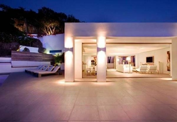 luxury villa with illuminated columns