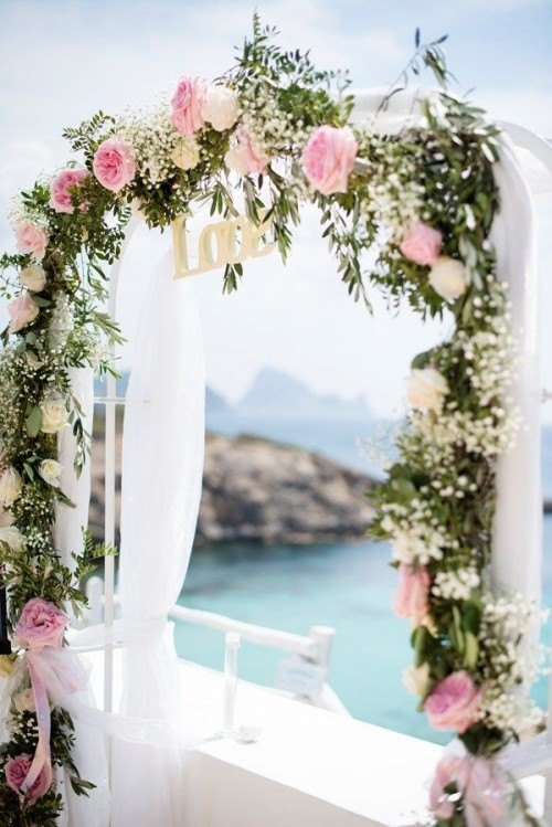 pink flowers arch wedding