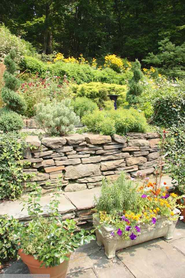 stone wall view beautiful flowers